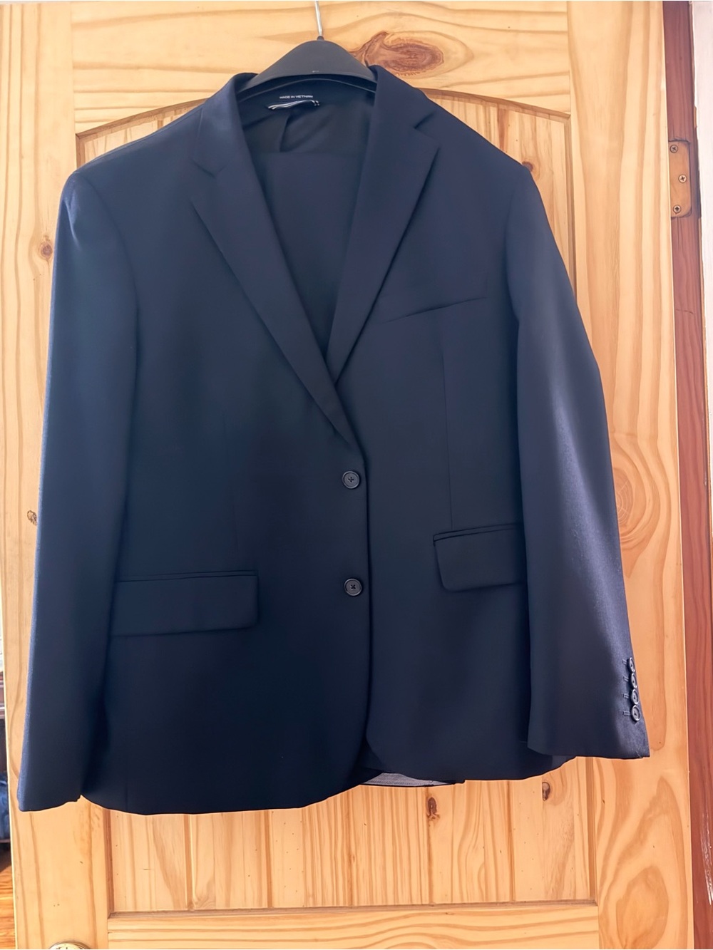 Nautica Men's navy Black Two-Button suit coat and pant set.
